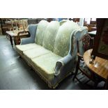A PRE-WAR WINGED LUNGE SUITE OF THREE PIECES, VIZ A THREE CHAIR BACK SETTEE AND A PAIR OF EASY