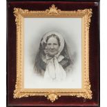 PAIR OF VICTORIAN PHOTOGRAPHIC PORTRAITS ON MILK GLASS, each within a fancy gilt moulded frame and