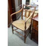 A NINETEENTH CENTURY POSSIBLY FRUITWOOD RUSH SEAT ARMCHAIR