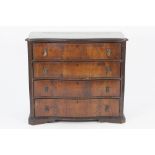 CHEST OF DRAWERS, the shaped oblong top with moulded edge, above four long, flame cut drawers,