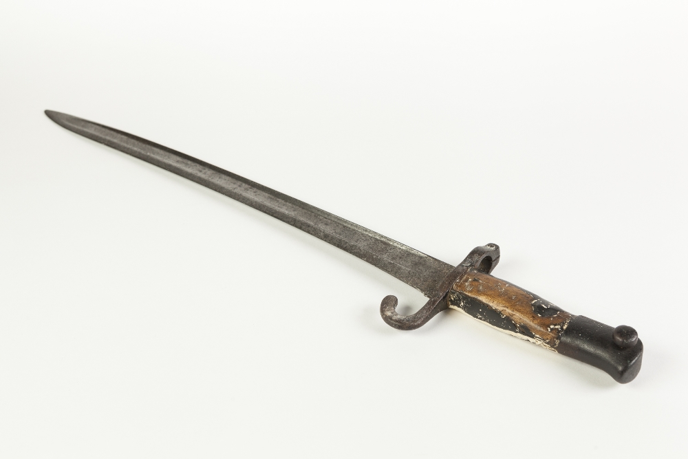 NINETEENTH CENTURY SWORD BAYONET, with slightly curved single edged blade, scrolled guard, wooden