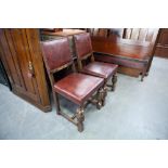 A PAIR OF OAK REPRODUCTION DINING CHAIRS, PAD BACK AND SEAT WITH STUD DETAIL AND CUP AND COVER