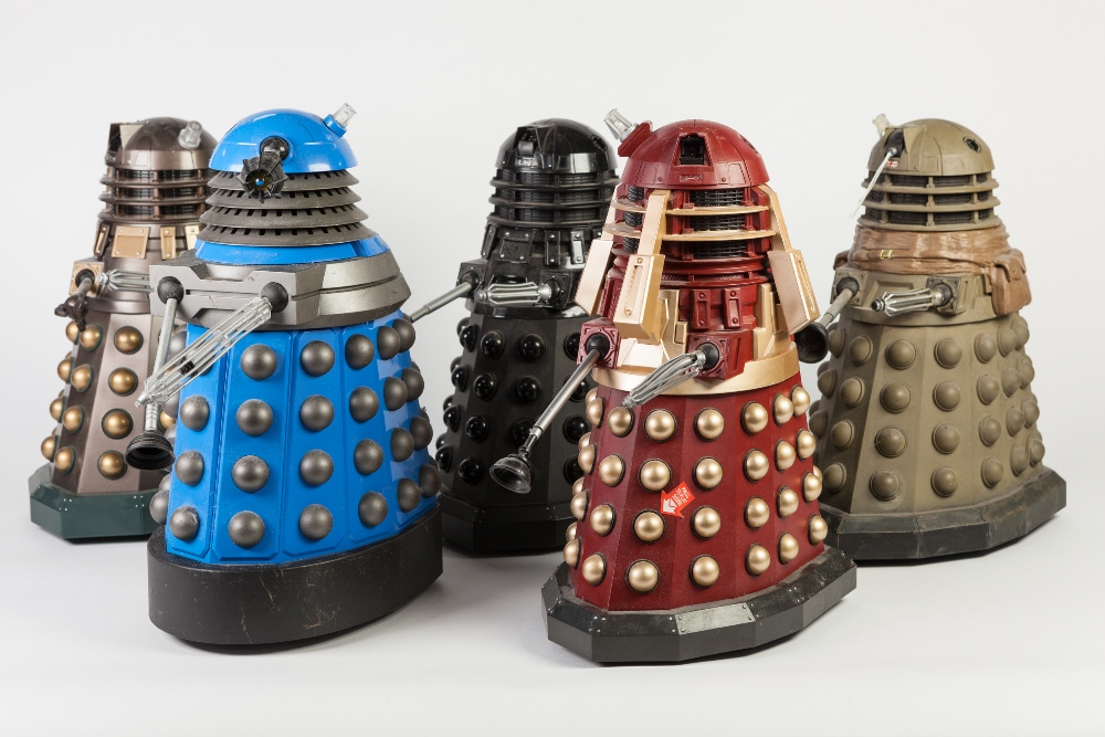 ELEVEN BATTERY OPERATED PLASTIC MODELS OF DALEKS, including a CHROME FINISHED EXAMPLE, 12 ¼" (