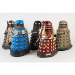 ELEVEN BATTERY OPERATED PLASTIC MODELS OF DALEKS, including a CHROME FINISHED EXAMPLE, 12 ¼" (