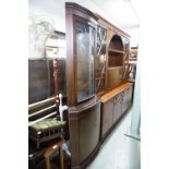 A MAHOGANY DOUBLE CORNER CUPBOARD WITH BOW FRONT