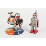 CHINESE 'MARS-10 SPACE STATION' WIND UP TIN PLATE SPACE CRAFT AND ASTRONAUT WITH CAMERA, 6 ¾" (17.