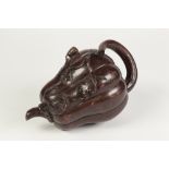 A CHINESE LATE QING DYNASTY YIXING RED EARTHENWARE BROWN PATINATED PUMPKIN FORM TEAPOT, with stack