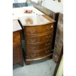 A SMALL REPRODUCTION MAHOGANY BOW FRONT CHEST OF FOUR DRAWERS