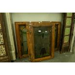 FOUR WOODEN FRAMED LEADED STAINED GLASS WINDOW FRAMES, 25 1/2" (65CM HIGH, 17 1/4" (44CM) WIDE (4)