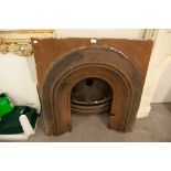 PAIR OF LATE VICTORIAN CAST IRON FIRE SURROUNDS WITH ARCHED RECESSES, ONE WITH GRATE IN SITU, 38" (