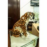 LARGE POTTERY MODEL OF A SEATED LEOPARD, 18" HIGH