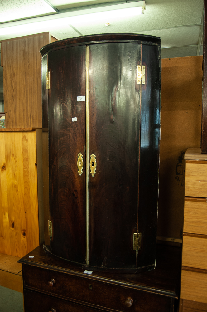 GEORGE III MAHOGANY BOW FRONTED HANGING CORNER CUPBOARD WITH BRASS BUTTERFLY HINGES