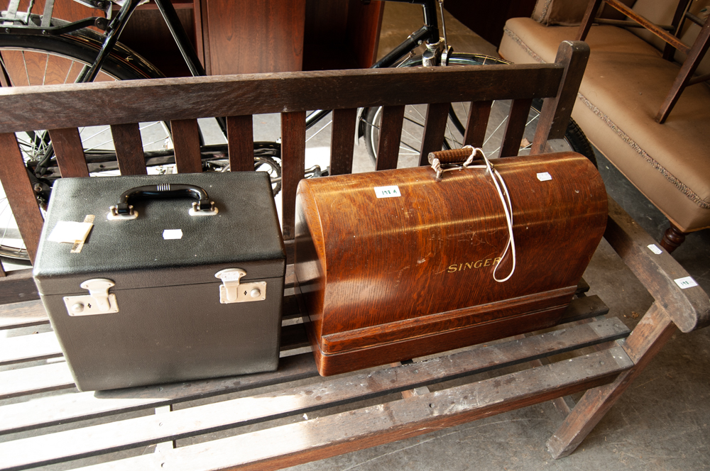 PORTABLE SINGER SEWING MACHING, IN DOME CASE AND ANOTHER SINGER SEWING MACHINE, IN BLACK CARRYING