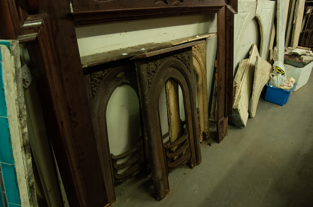 THREE SMALL LATE VICTORIAN CAST IRON BEDROOM FIRE SURRIONDS WITH GRATES IN SITU, 32 1/2" (82.5CM)