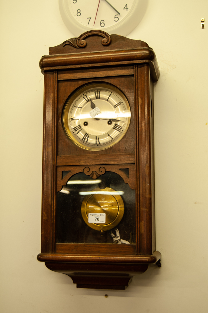 A MAHOGANY WELLINGTON TYPE WALL CLOCK