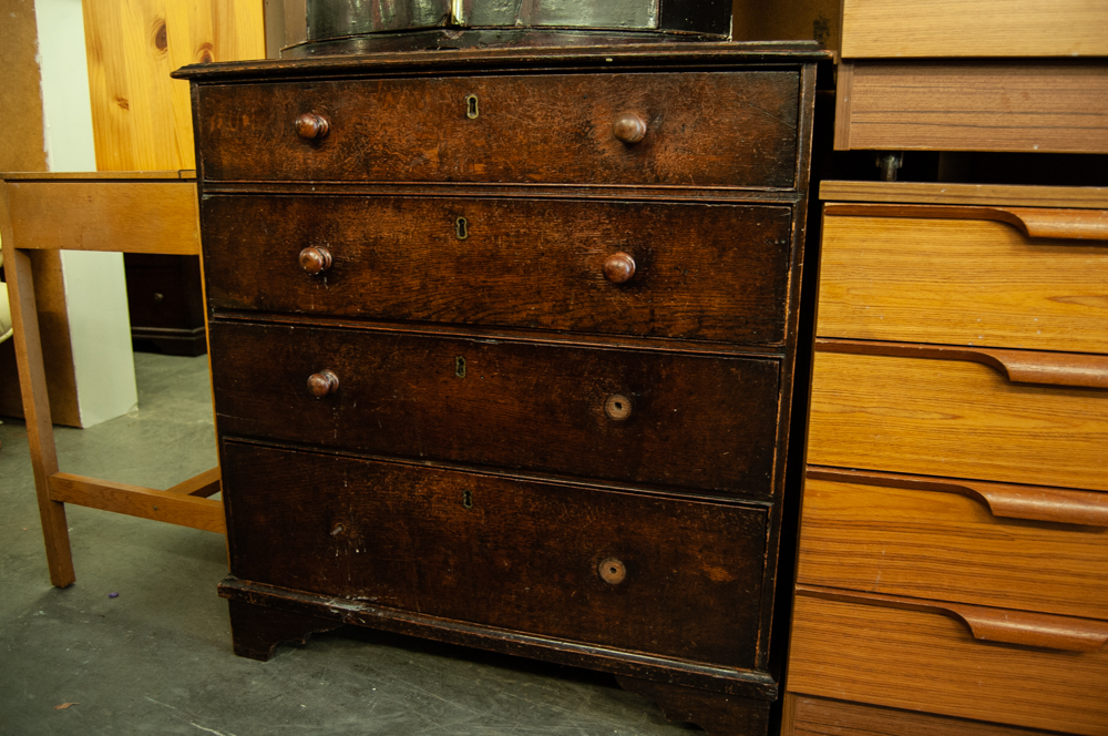 SMALL 19TH CENTURY OAK CHEST OF FOUR GRADUATED LONG DRAWERS WITH WOOD KNOB HANDLES, ON BRACKET FEET,