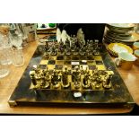 PEWTER CHESS SET IN THE FORM OF ROMAN CENTURIONS AND THE CHESSBOARD STAND
