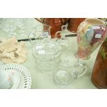 A COLLECTION OF CUT GLASS TABLE WARES TO INCLUDE; A CRACKER BARREL AND LID, WATER JUGS ETC.......