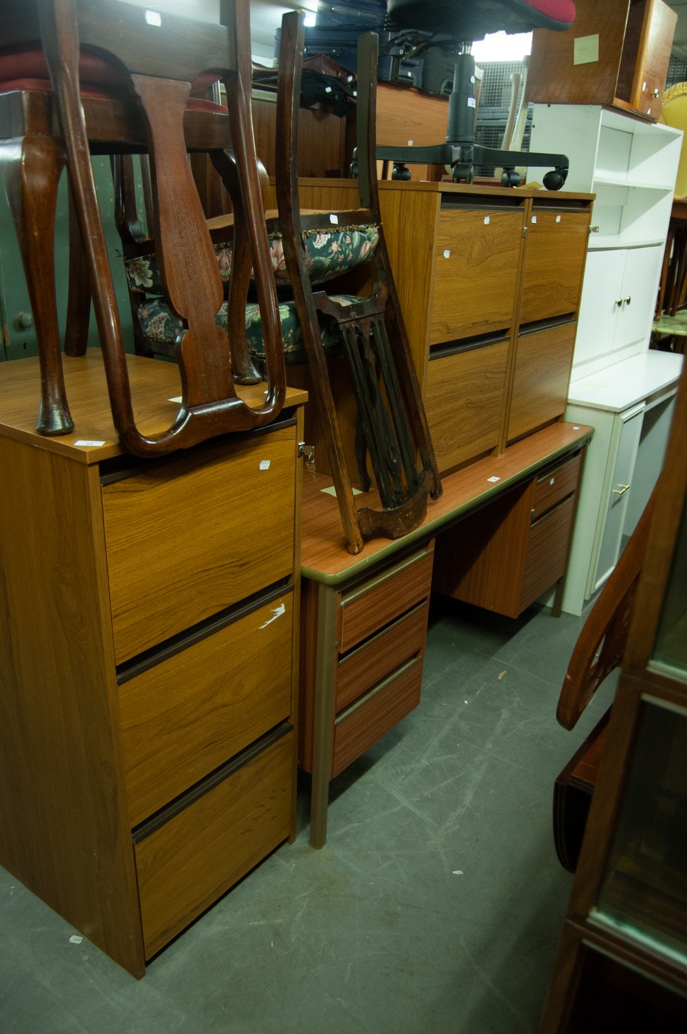 A TEAK FINISH THRE DRAWER FILING CABINET AND TWO TWO-DRAWER DITTO (3)