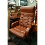 AN EXECUTIVE'S LIGHT TAN HIDE ALL-UPHOLSTERED REVOLVING ARMCHAIR, ON ALUMINIUM FIVE SPUR BASE