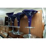 SET OF FOUR BAR STOOLS WITH BLACK PLASTIC REVOLVING SEATS, ON STAINLESS STEEL CIRCULAR BASES