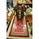 MODERN ORIENTAL CARVED HARDWOOD LANTERN, of octagonal form inset with reverse painted panels