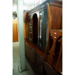 A MODERN REPRODUCTION MAHOGANY DISPLAY CABINET, THE UPPER PORTION WITH ENCLOSED GLASS SHELVED