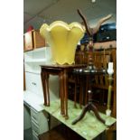 A NEST OF THREE REPRODUCTION GLASS INSET TOPPED TABLES, A SIMILAR COFFEE TABLE, TWO REPRODUCTION