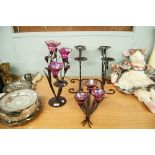 PAIR OF BLACK WROUGHT IRON PLANT FORM THREE LIGHT CANDELABRA WITH PURPLE GLASS SCONCES AND THE