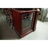 A REPRODUCTION MAHOGANY CORNER DISPLAY UNIT WITH ARCHED GLAZED DOOR AND MATCHING CABINET WITH SONY