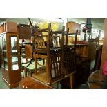 A SET OF FOUR OAK THREE RAIL BACK SINGLE CHAIRS