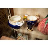 TWO EARLY TWENTIETH CENTURY ROYAL CROWN DERBY BLUE AND GILT CHINA VASES WITH FLORAL PAINTED