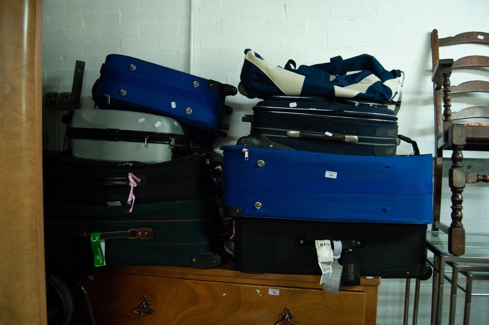 SEVEN VARIOUS SUITCASES AND A HOLD-ALL