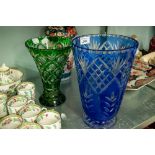 TWO BOHEMIAN FLASH CUT GLASS VASES, one of cylindrical, footed form in blue, 10 ½" (26.7cm) high,