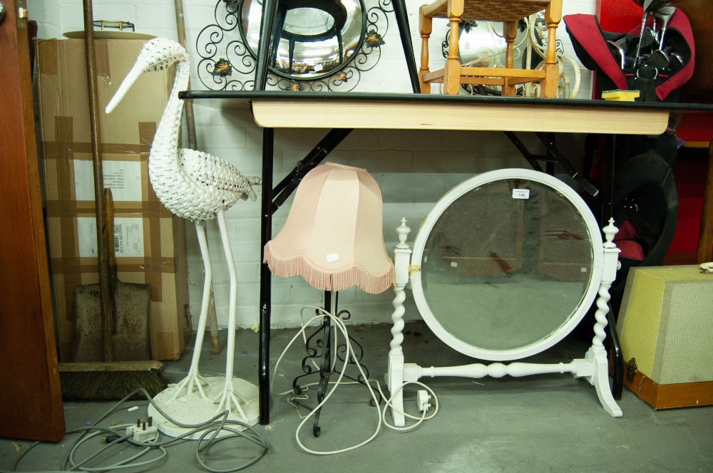 A WHITE PAINTED CIRCULAR CHEVAL TOILET MIRROR AND A BLACK WROUGHT IRON TABLE LAMP AND A STORK