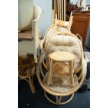 A PAIR OF ROTATING BAMBOO CONSERVATORY CHAIRS, A MATCHING GLASS TOP TABLE AND FOOTSTOOL, A PAIR OF
