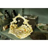 CUT GLASS FRUIT BOWL ON SCROLL FEET AND AN ITALIAN POTTERY FLORAL ENCRUSTED BASKET PATTERN BOWL