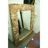 A LARGE MODERN ORNATE GILT FRAMED BEVELLED EDGE WALL MIRROR