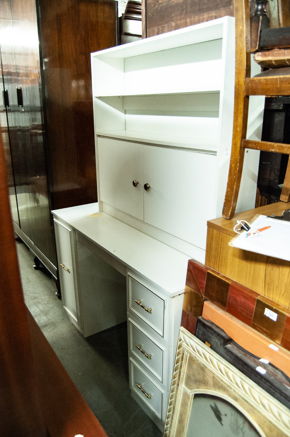 A WHITE FINISH DOUBLE PEDESTAL DRESSING TABLE, A WHITE MELAMINE BOOKCASE AND A WALNUT BEDSIDE