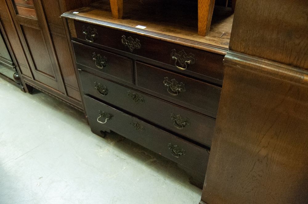 A SMALL GEORGIAN MAHOGANY CHEST OF OROLO MOULDED DRAWERS ON REPLACED BRACKET FEET