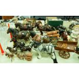 COLLECTION OF POTTERY SHIRE HORSES AND A RELATED CART (12 IN TOTAL)