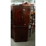 A REPRODUCTION CORNER COCKTAIL CABINET