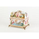 MODERN CAPODIMONTE MOULDED PORCELAIN AND GILT METAL MOUNTED CASKET, of domed top form with top