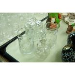 A COLLECTION OF CUT GLASS TABLE WARES TO INCLUDE; A CRACKER BARREL AND LID, WATER JUGS ETC.......