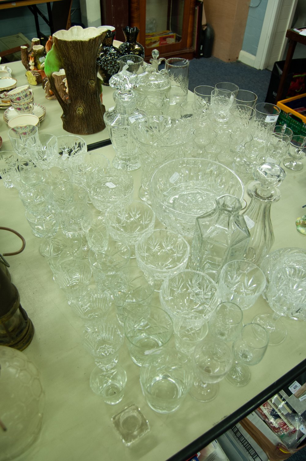 A COLLECTION OF CUT GLASS AND CRYSTAL GLASSES, VASES, DECANTERS, GRAPEFRUIT BOWLS ETC.....