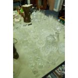 A COLLECTION OF CUT GLASS AND CRYSTAL GLASSES, VASES, DECANTERS, GRAPEFRUIT BOWLS ETC.....