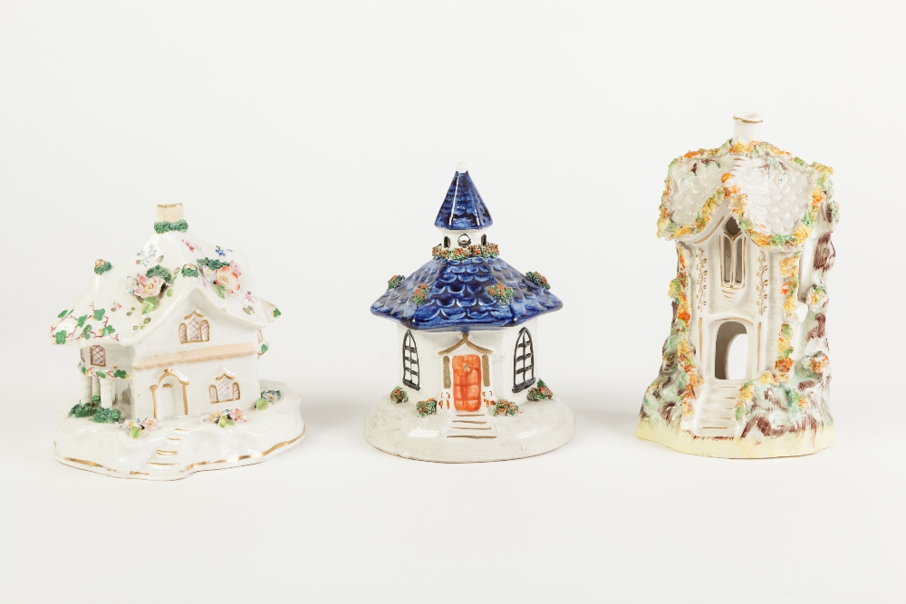 THREE NINETEENTH CENTURY AND LATER STAFFORDSHIRE POTTERY COTTAGE PATTERN PASTILLE BURNERS, all