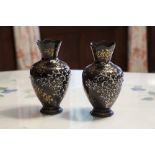 A PAIR OF ITALIAN DARK BLUE ENAMELLED METAL OVULAR VASES WITH WAVY TOPS AND HAVING ENAMELLED, GILT