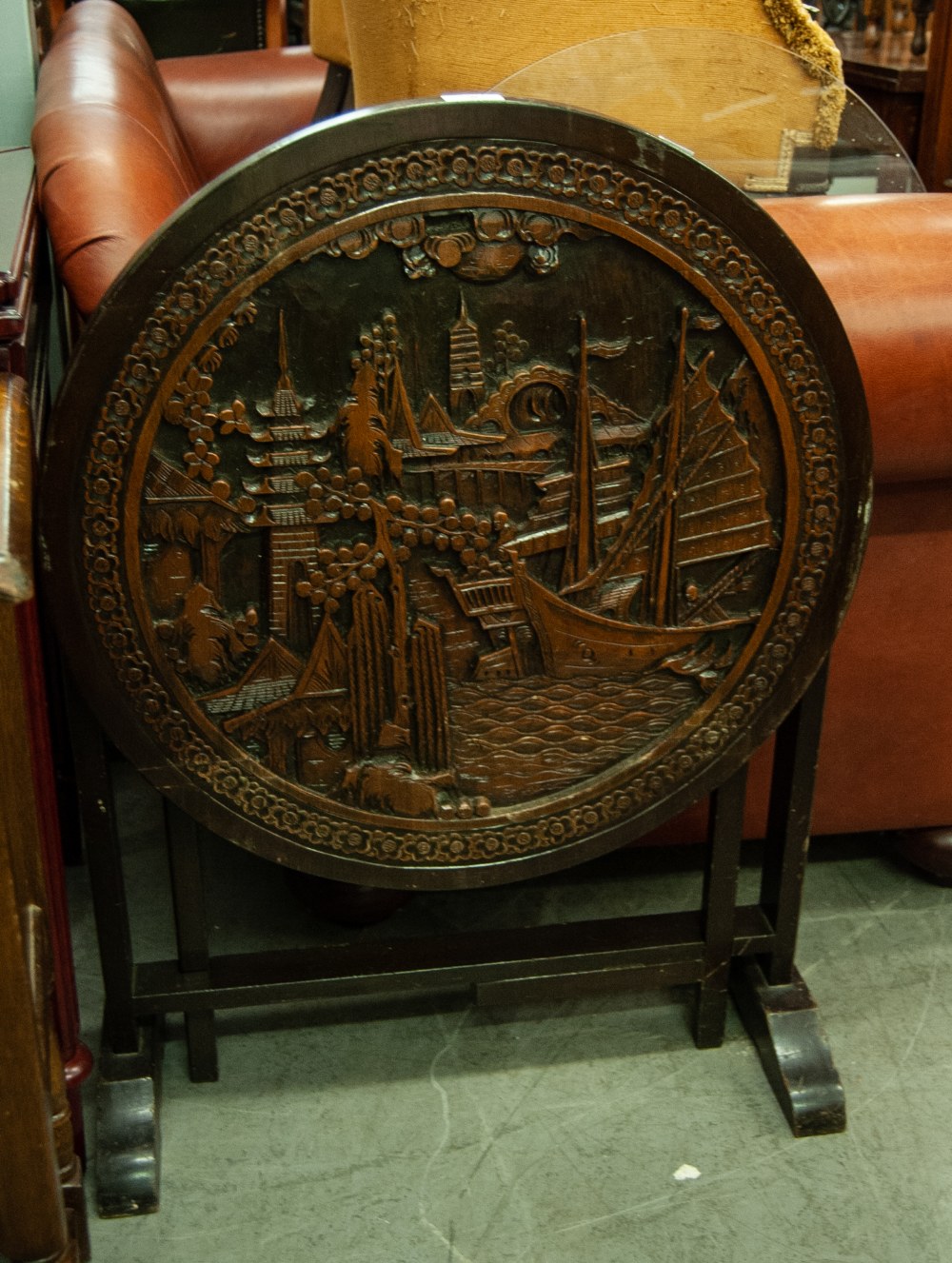 A MODERN ORIENTAL HIGH RELIEF CIRCULAR TABLE, FEATURING A NAUTICAL SCENE AND FOLIAGE, ON FOUR