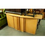 A LARGE BEECHWOOD MODERN SIDEBOARD WITH FOUR CUPBOARDS AND A SINGLE CENTRAL DRAWER WITH SHAPED TOP